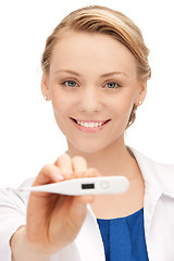 Image showing attractive female doctor with thermometer