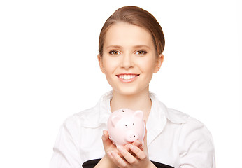 Image showing lovely woman with piggy bank