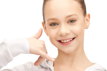 Image showing teenage girl making a call me gesture