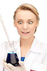 Image showing lab worker holding up test tube