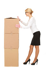 Image showing attractive businesswoman with big boxes