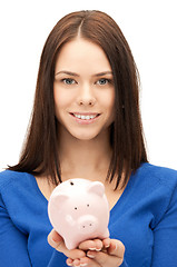 Image showing lovely woman with piggy bank