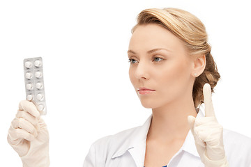 Image showing attractive female doctor with pills