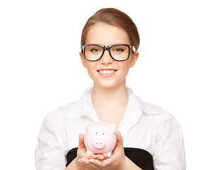 Image showing lovely woman with piggy bank