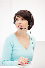 Image showing helpline operator with laptop computer