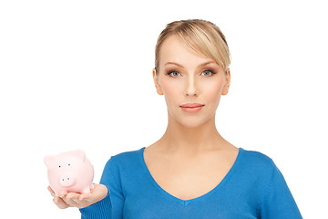 Image showing lovely woman with piggy bank