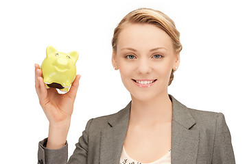 Image showing lovely woman with piggy bank