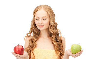 Image showing young beautiful woman with green and red apples