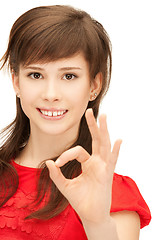 Image showing lovely teenage girl showing ok sign