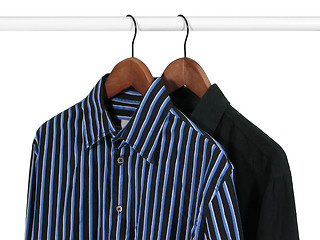 Image showing Two shirts on a rack