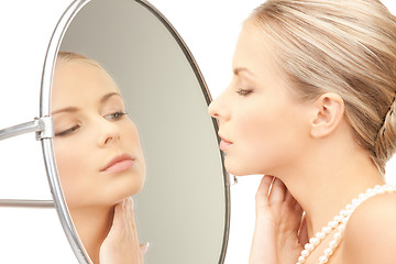 Image showing beautiful woman with pearl beads and mirror