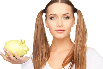 Image showing lovely woman with piggy bank