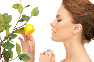 Image showing lovely woman with lemon twig