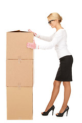 Image showing attractive businesswoman with big boxes