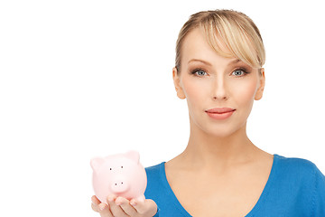 Image showing lovely woman with piggy bank