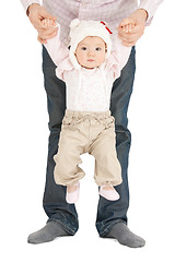 Image showing baby hanging on fathers hands