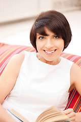 Image showing happy and smiling woman with book