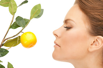 Image showing lovely woman with lemon twig