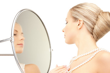 Image showing beautiful woman with pearl beads and mirror