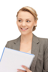 Image showing happy woman with big notepad