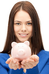 Image showing lovely woman with piggy bank