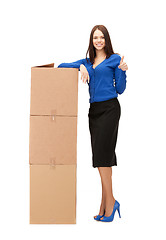Image showing attractive businesswoman with big boxes