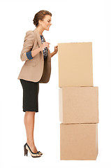 Image showing attractive businesswoman with big boxes