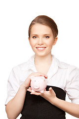 Image showing lovely woman with piggy bank