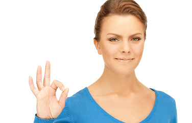 Image showing lovely teenage girl showing ok sign