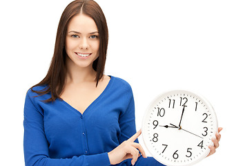 Image showing woman holding big clock