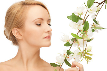 Image showing beautiful woman with orchid flower