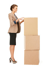 Image showing attractive businesswoman with big boxes