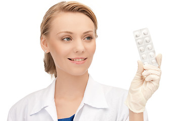 Image showing attractive female doctor with pills