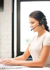 Image showing helpline operator with laptop computer