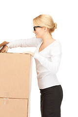 Image showing attractive businesswoman with big boxes