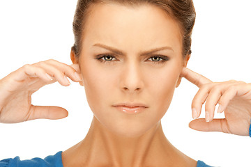 Image showing woman with fingers in ears