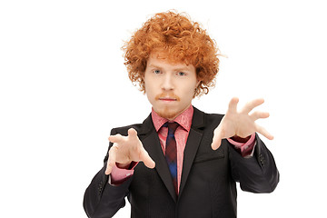 Image showing businessman working with something imaginary