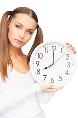 Image showing woman holding big clock