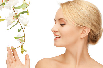 Image showing beautiful woman with orchid flower