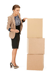 Image showing attractive businesswoman with big boxes