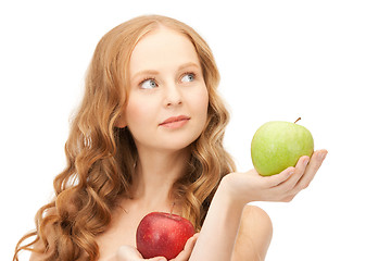 Image showing young beautiful woman with green and red apples