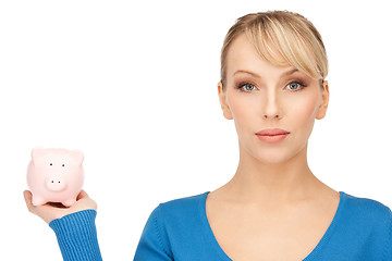 Image showing lovely woman with piggy bank