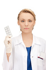 Image showing attractive female doctor with pills