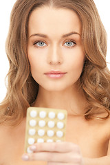 Image showing young beautiful woman with pills 