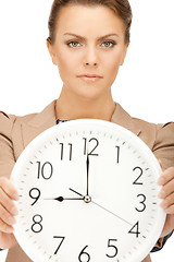 Image showing woman holding big clock