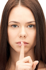 Image showing finger on lips