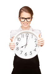 Image showing woman holding big clock