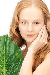 Image showing woman with green leaf