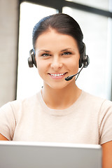 Image showing helpline operator with laptop computer