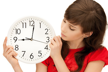 Image showing teenage girl holding big clock